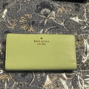kate spade light green continental wallet with gold logo
